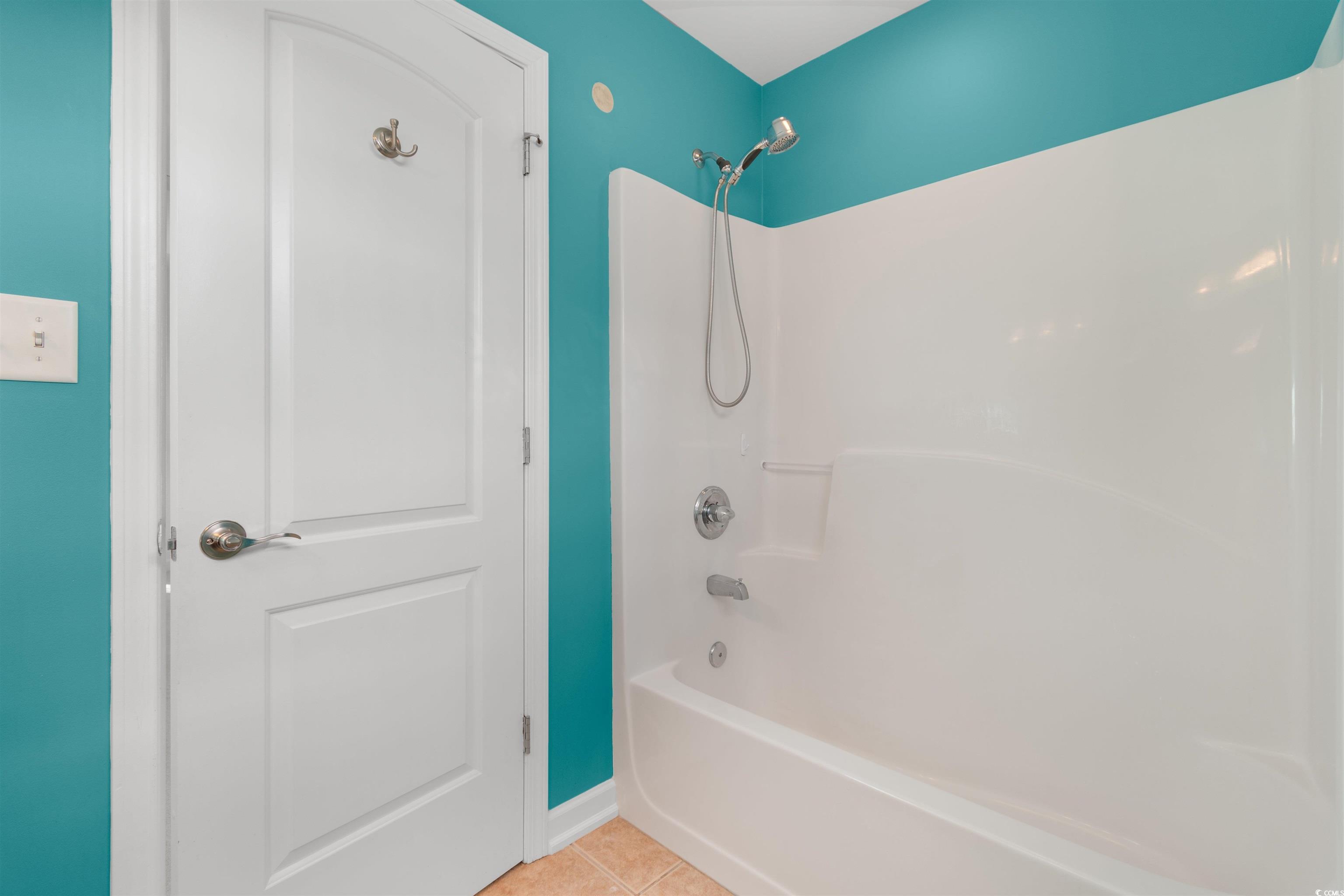 141 Terracina Circle Myrtle Beach, SC 29588 - Photo 18 of 40 Bathroom with shower / tub combination and tile pa