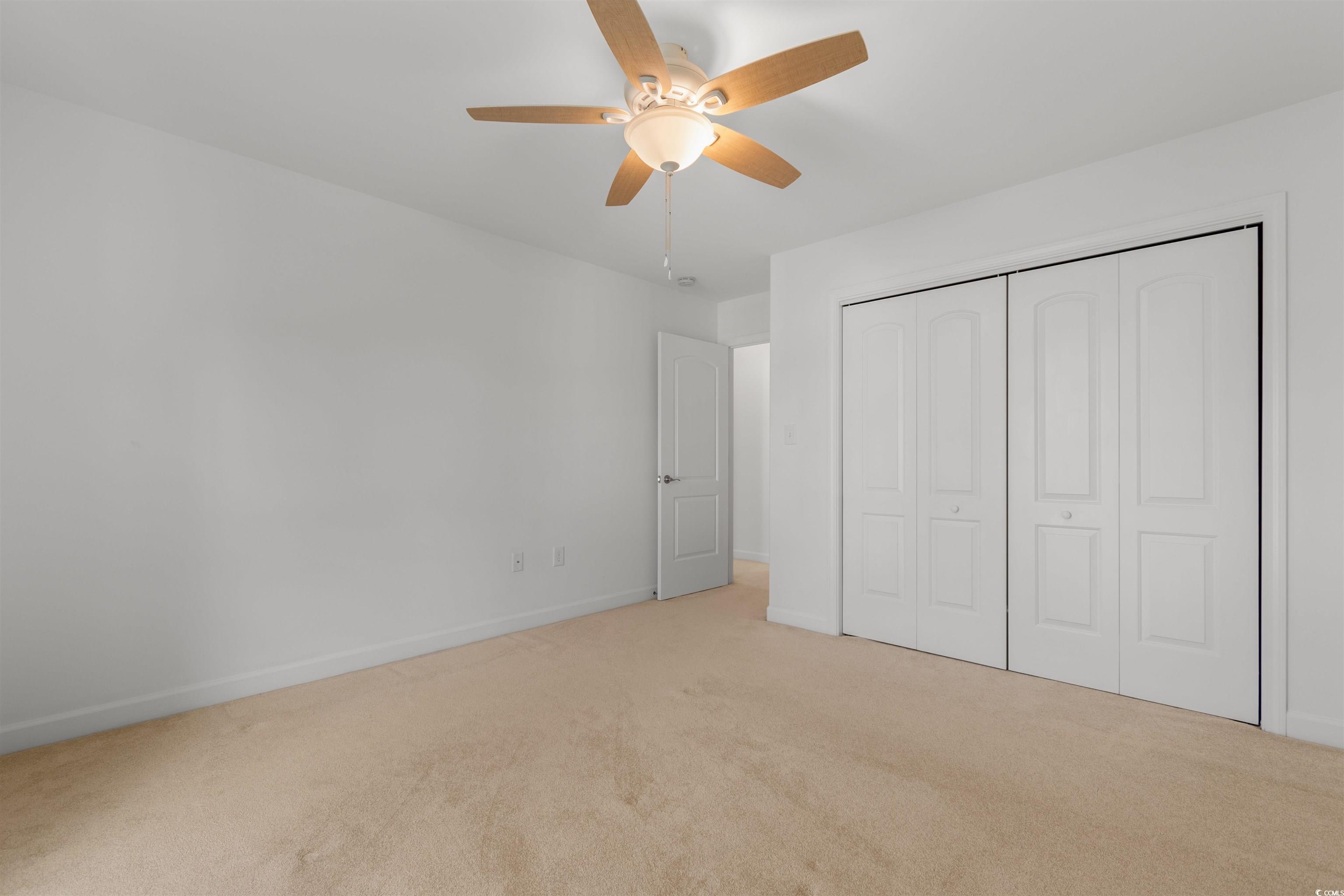 141 Terracina Circle Myrtle Beach, SC 29588 - Photo 24 of 40 Unfurnished bedroom with ceiling fan, a closet, an