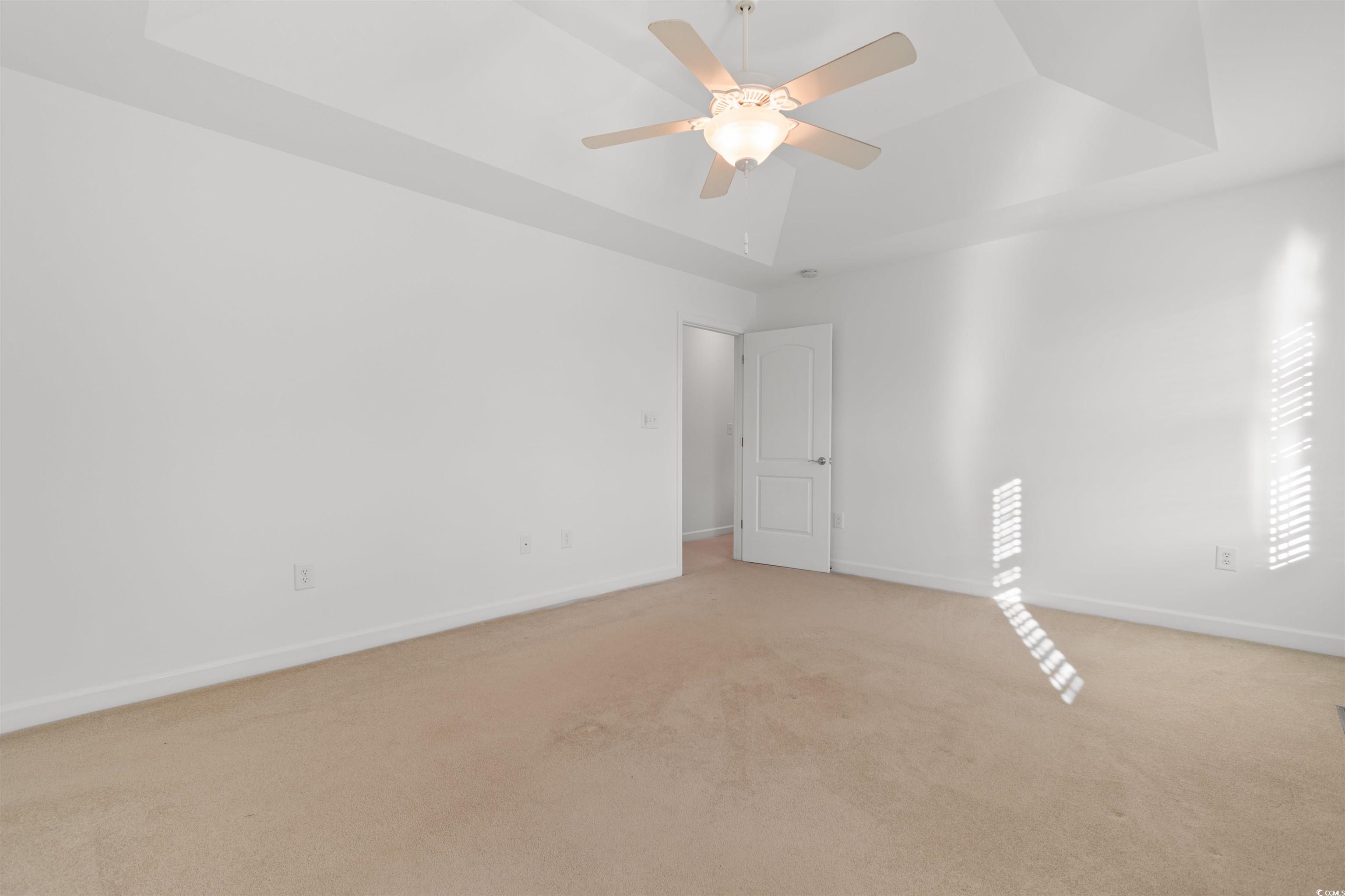141 Terracina Circle Myrtle Beach, SC 29588 - Photo 26 of 40 Carpeted empty room with ceiling fan and a tray ce
