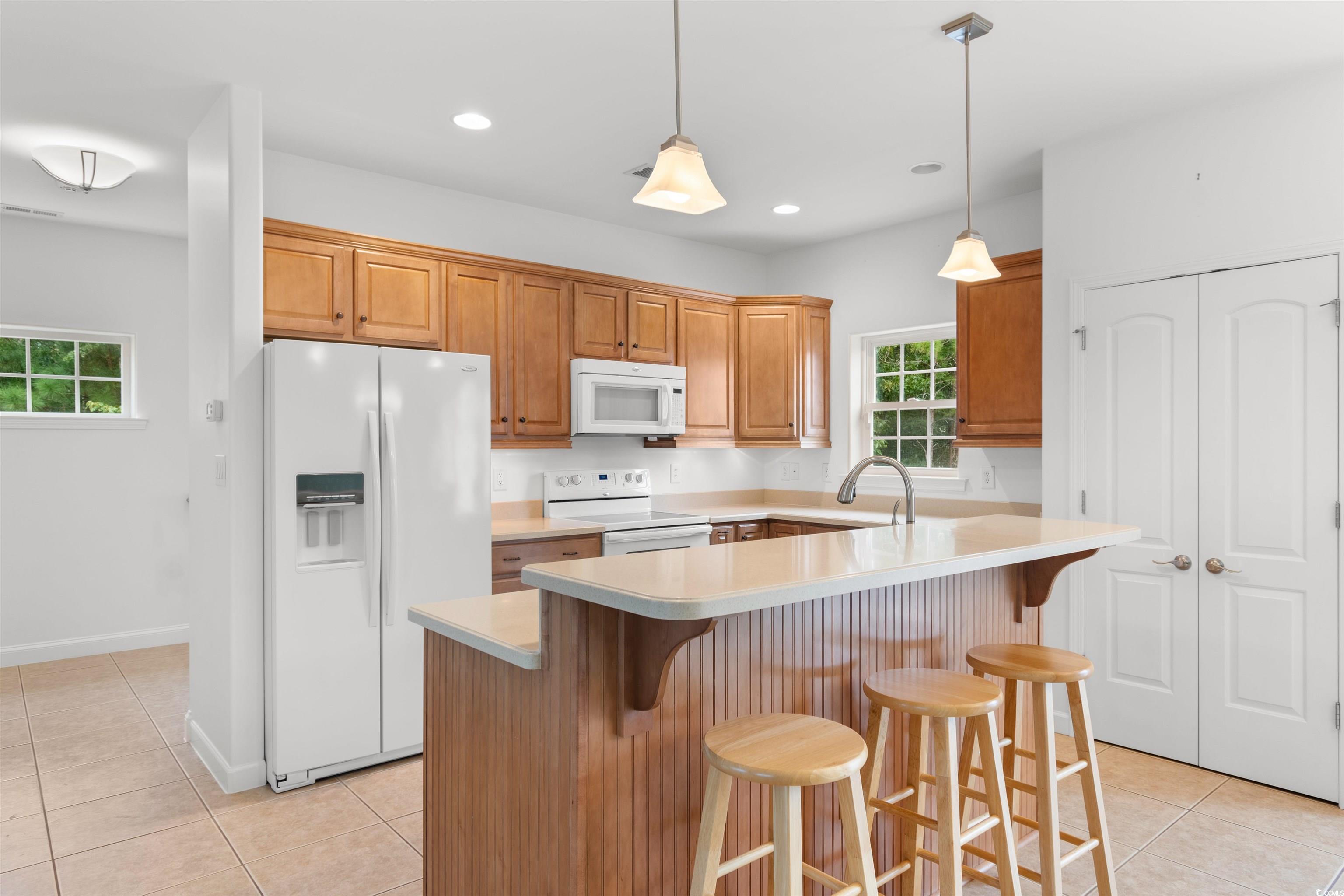 141 Terracina Circle Myrtle Beach, SC 29588 - Photo 7 of 40 Kitchen featuring light tile patterned flooring, s