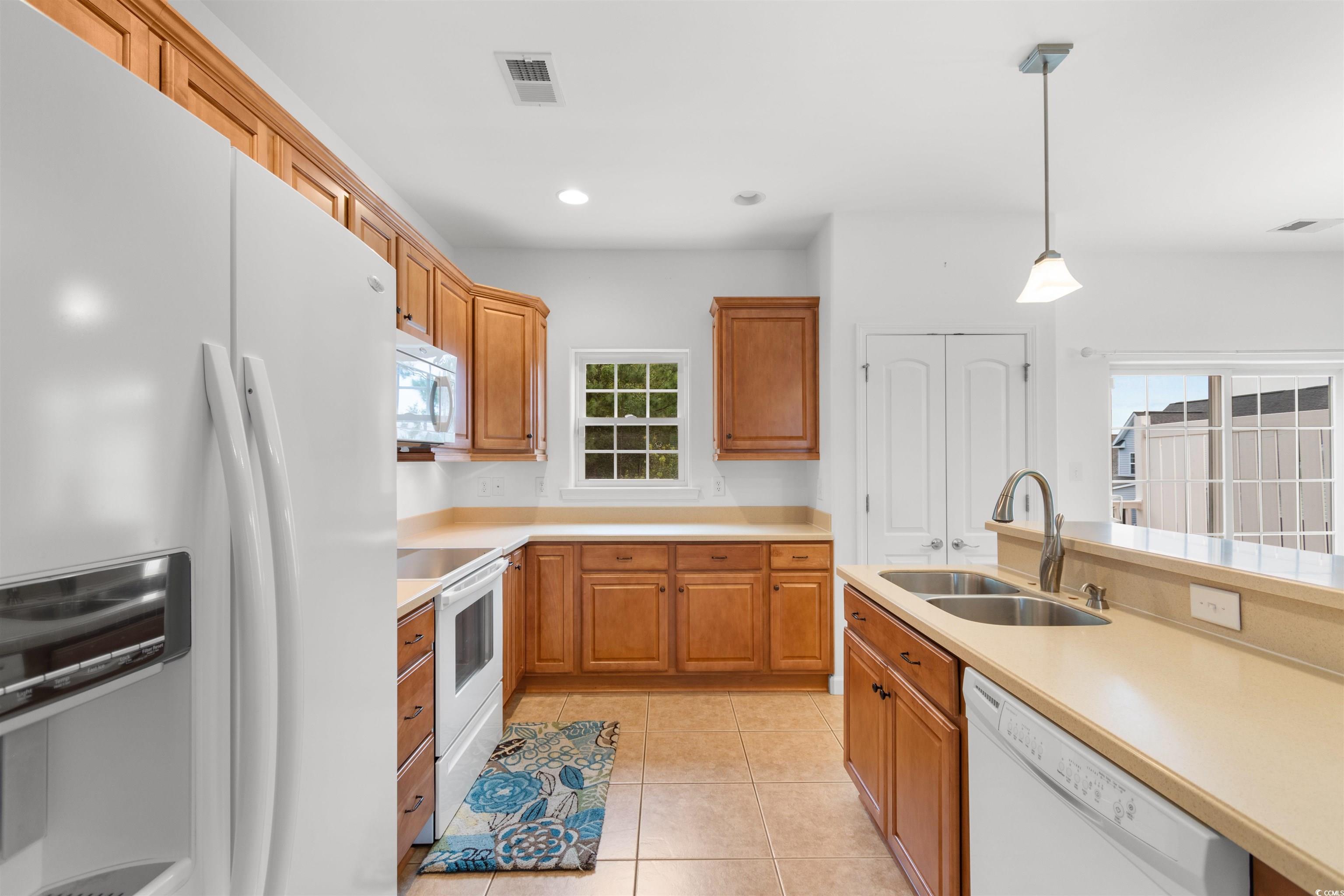 141 Terracina Circle Myrtle Beach, SC 29588 - Photo 10 of 40 Kitchen featuring hanging light fixtures, white ap