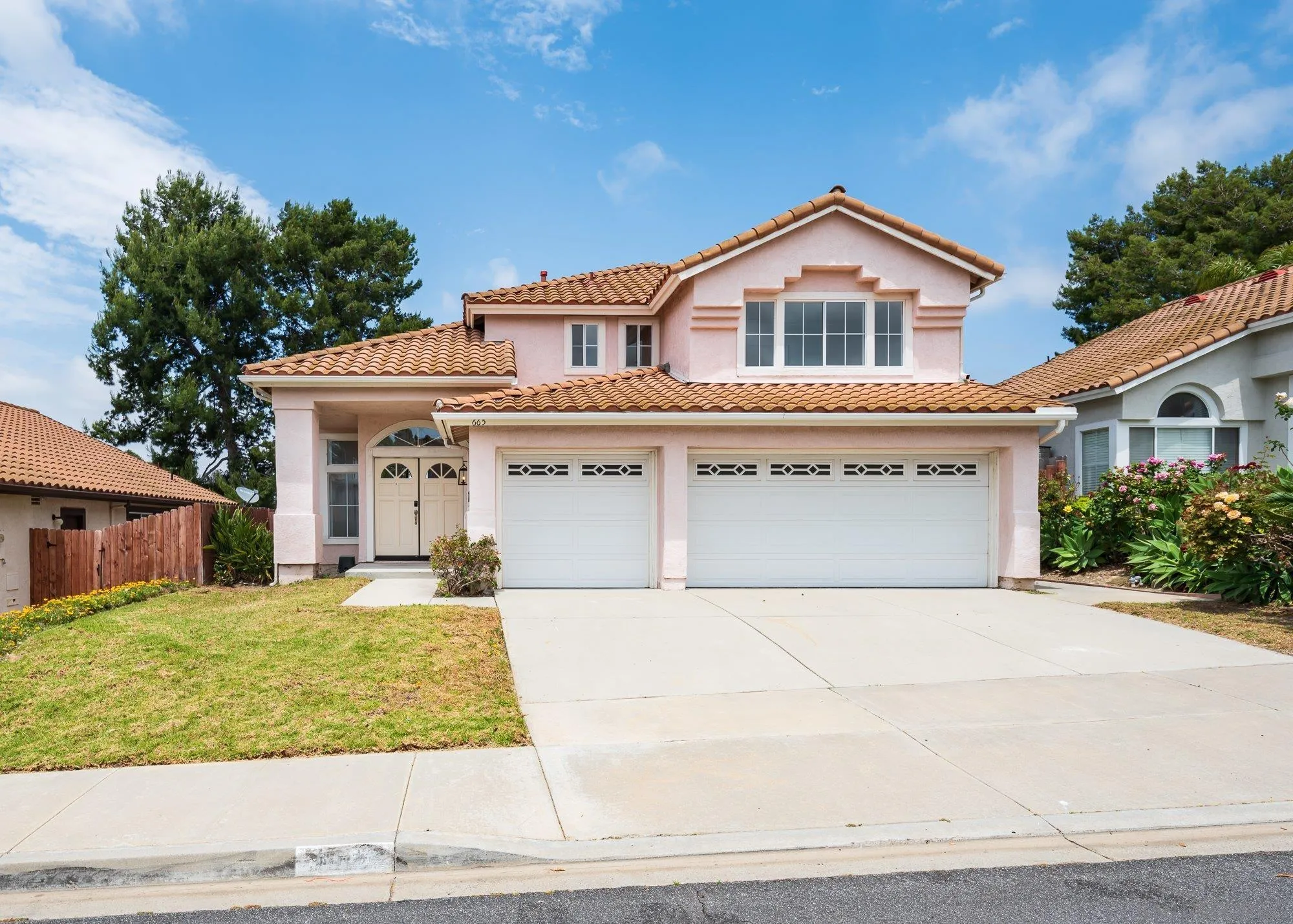 a front view of a house with garden
