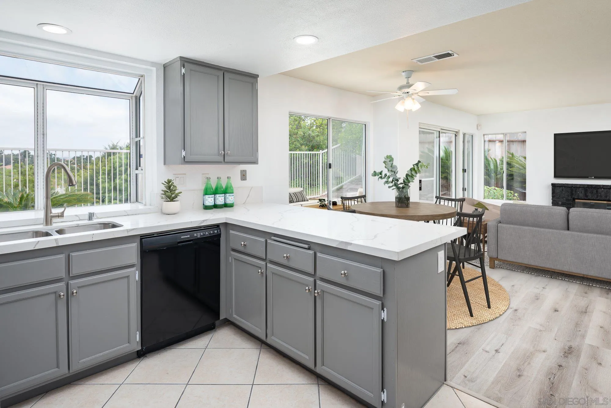 665 Montage Road Oceanside, CA 92057 - Photo 12 of 52 a kitchen with a sink window and cabinets