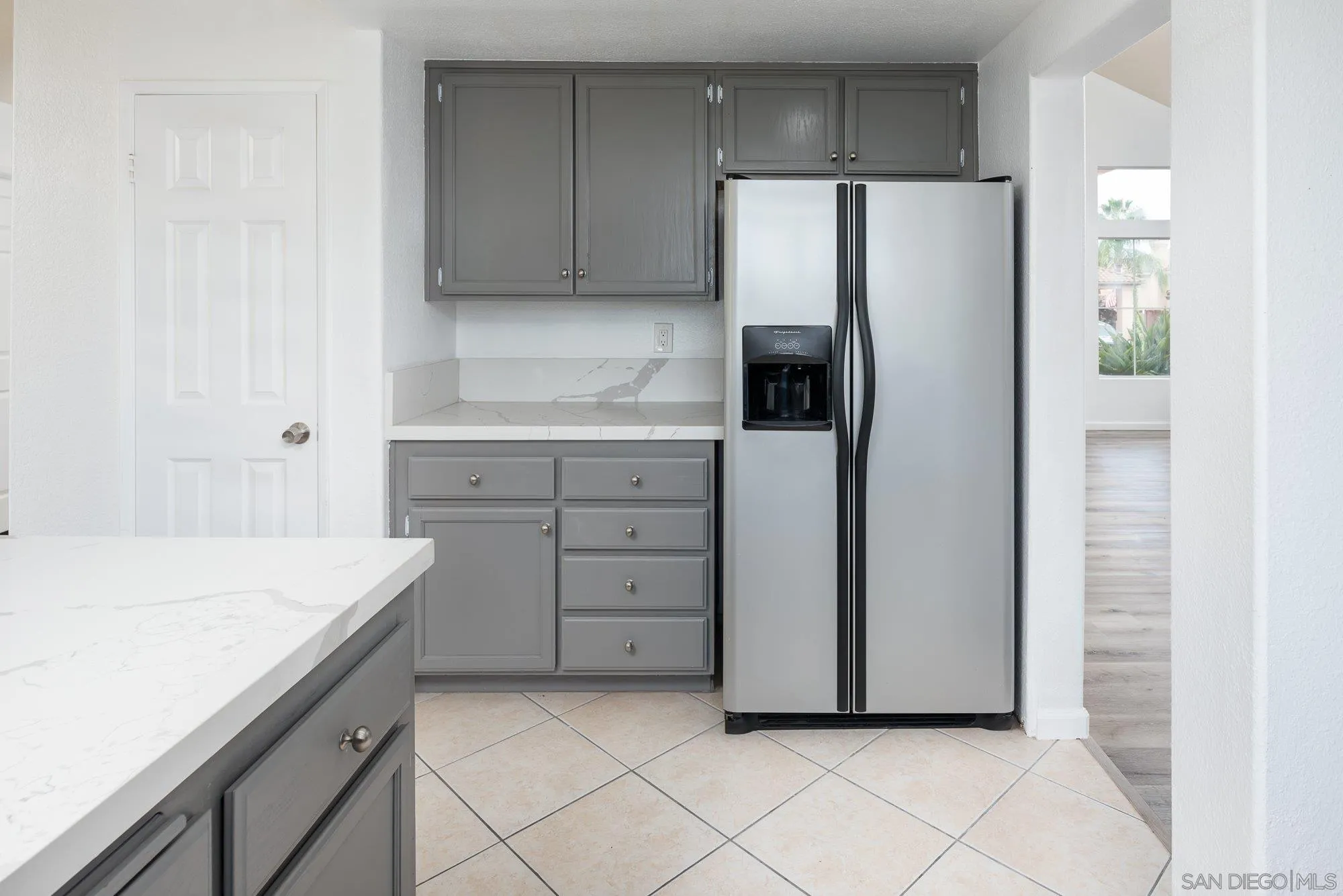 665 Montage Road Oceanside, CA 92057 - Photo 16 of 52 a kitchen with cabinets and white stainless steel appliances