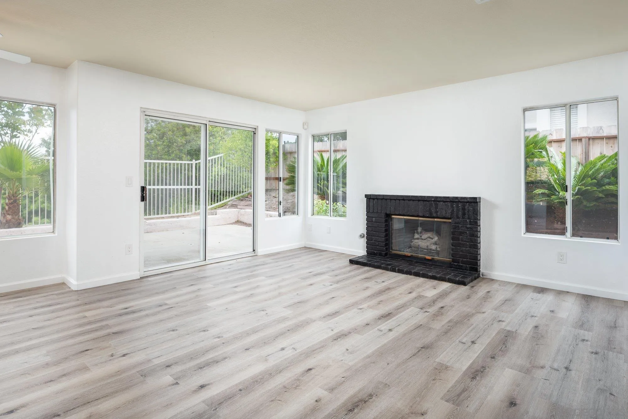 665 Montage Road Oceanside, CA 92057 - Photo 21 of 52 a view of empty room with wooden floor and fireplace