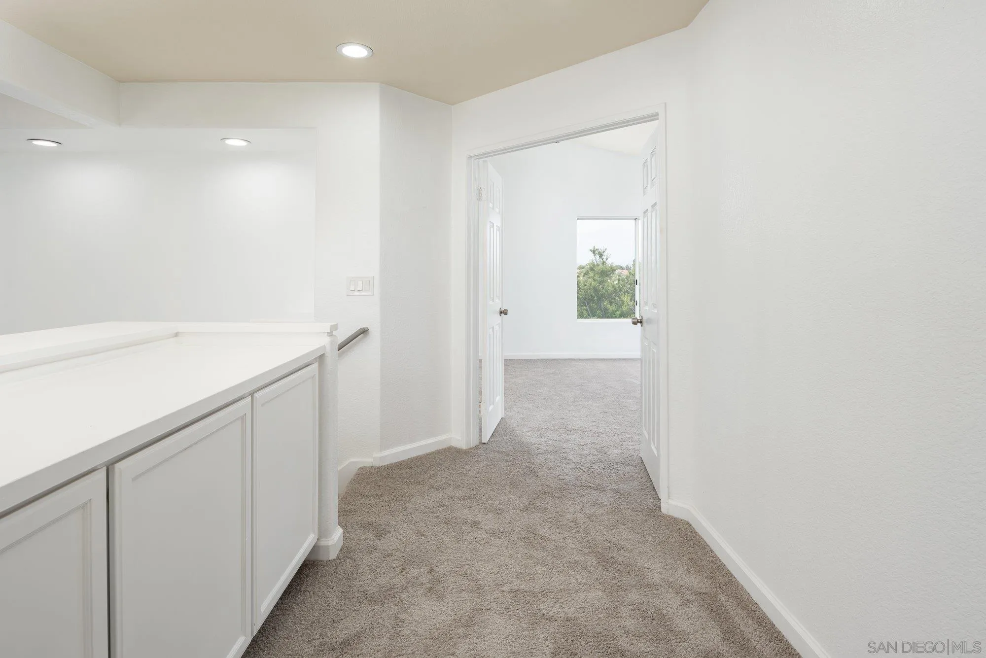 665 Montage Road Oceanside, CA 92057 - Photo 35 of 52 a view of a hallway to rooms
