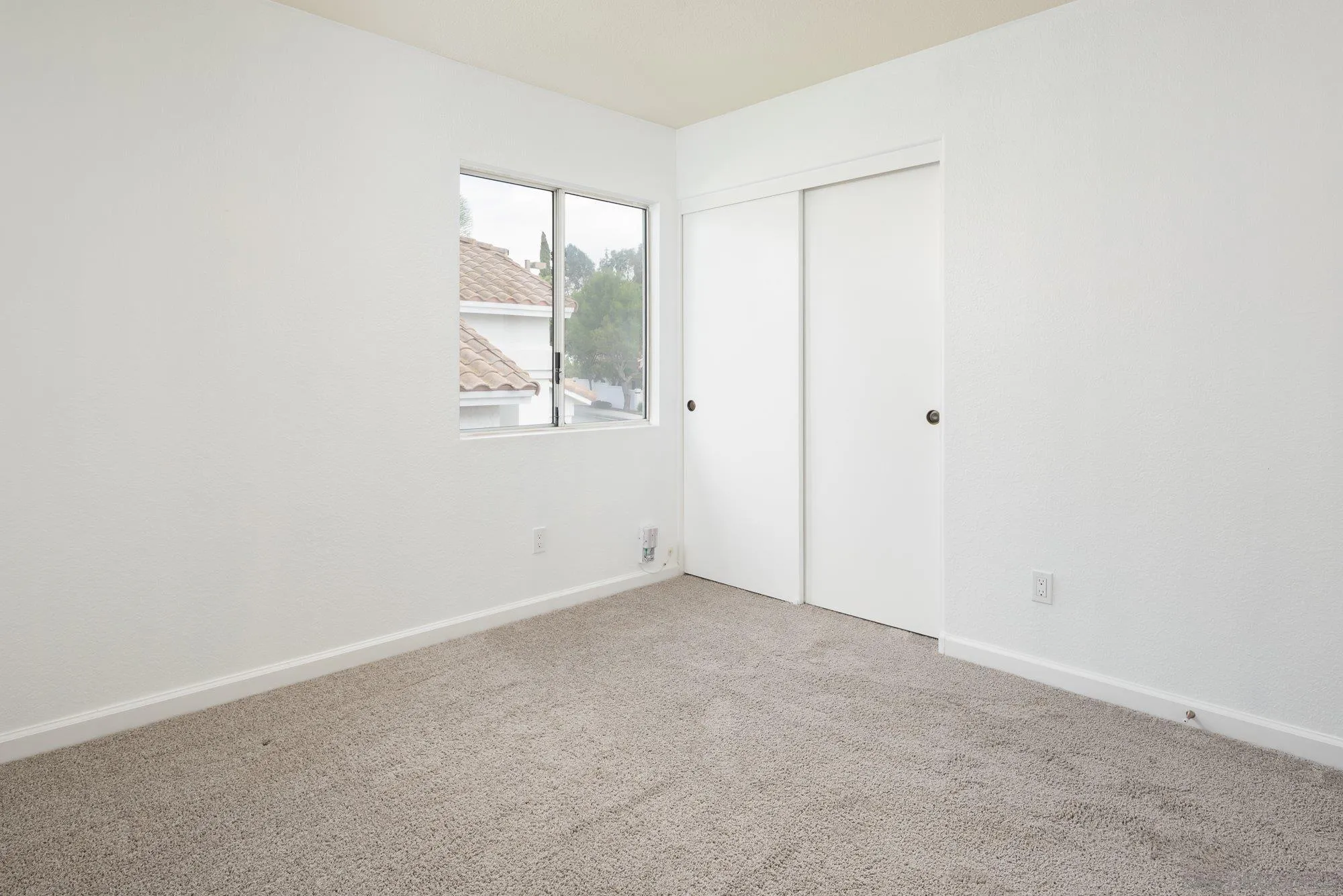 665 Montage Road Oceanside, CA 92057 - Photo 38 of 52 an empty room with windows and closet