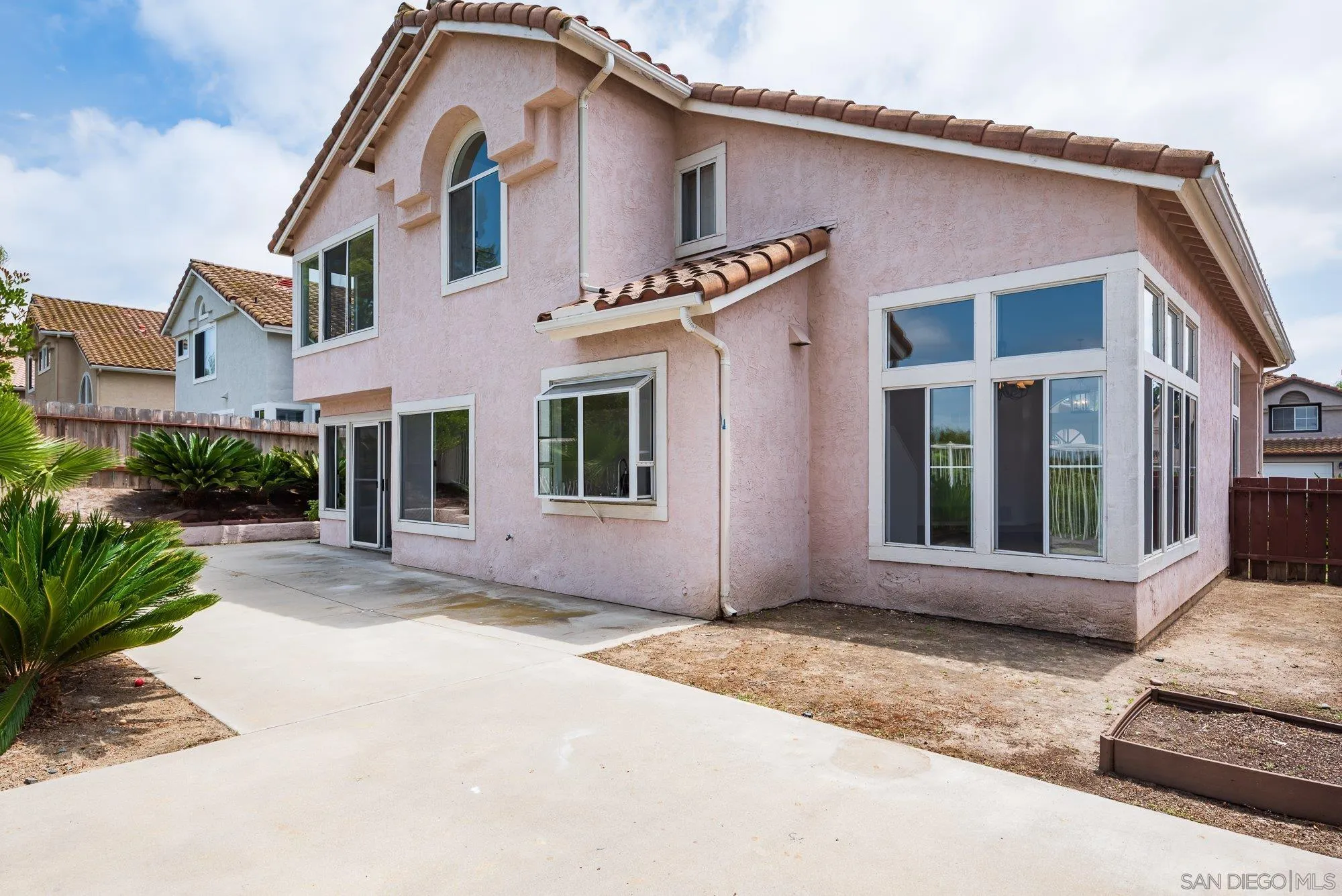 665 Montage Road Oceanside, CA 92057 - Photo 39 of 52 a front view of a house with a yard and garage