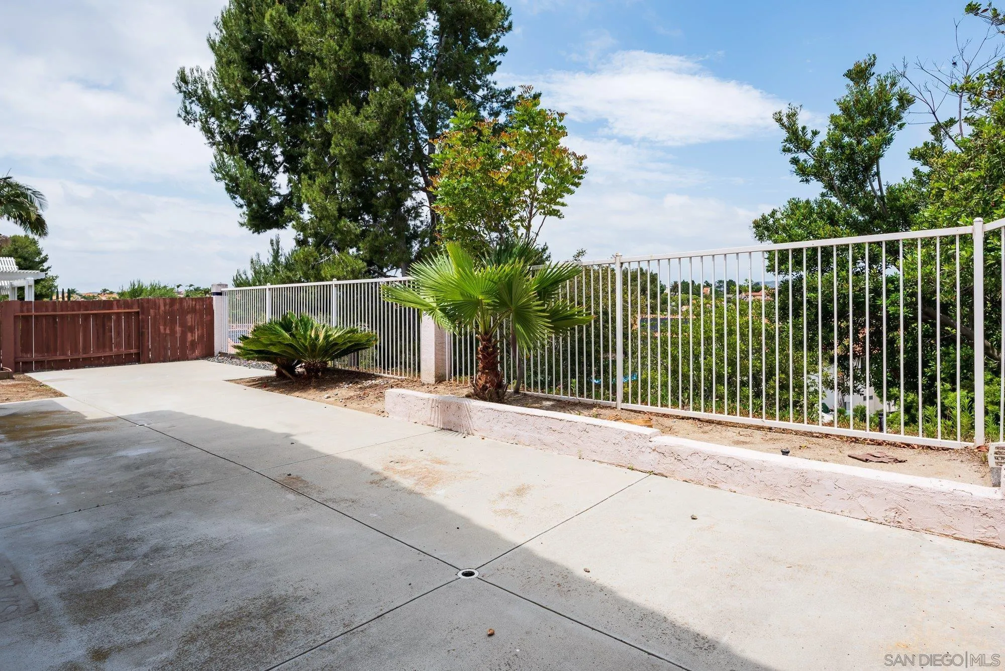 665 Montage Road Oceanside, CA 92057 - Photo 41 of 52 a view of a backyard with a garden
