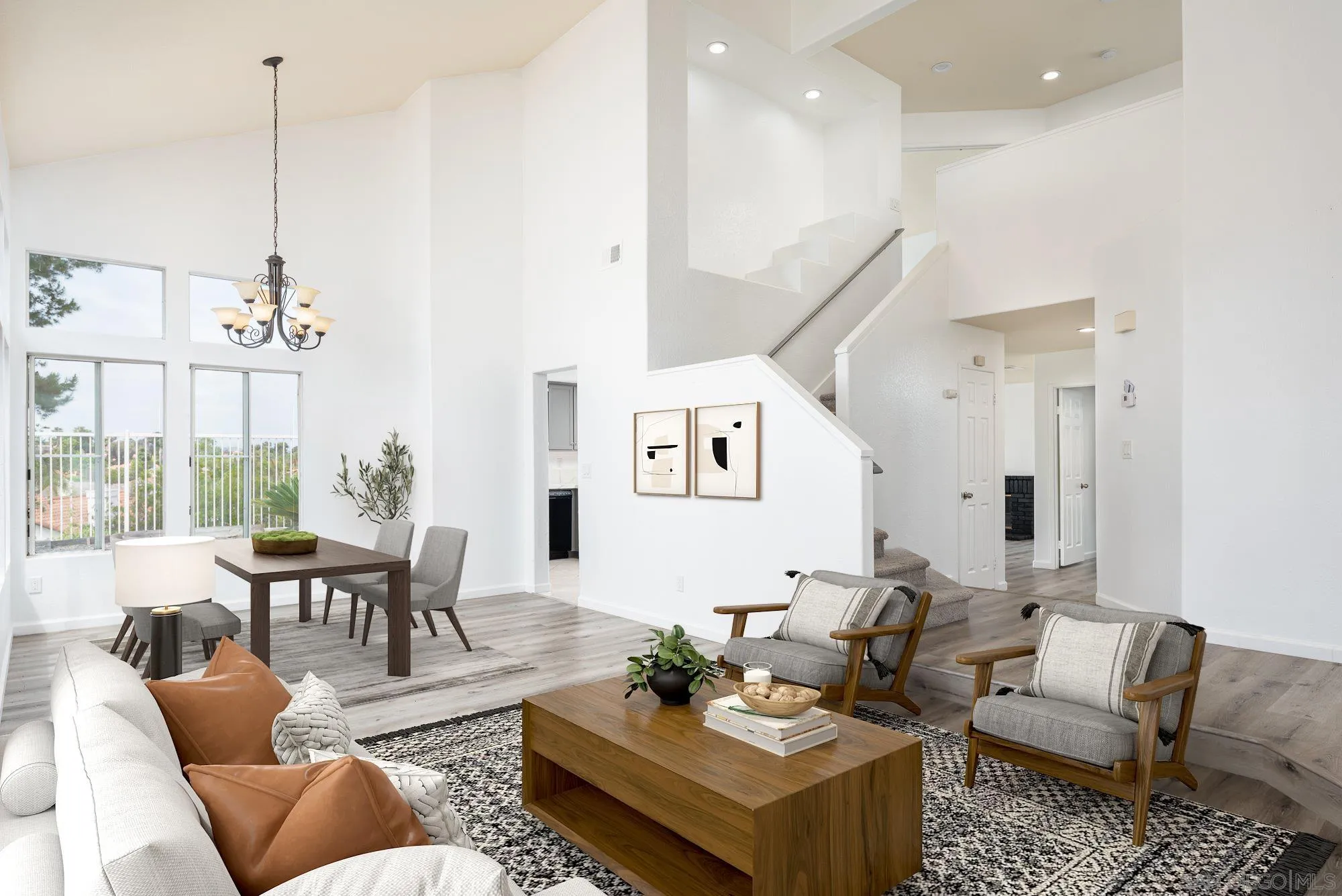 665 Montage Road Oceanside, CA 92057 - Photo 6 of 52 a living room with furniture kitchen view and a chandelier