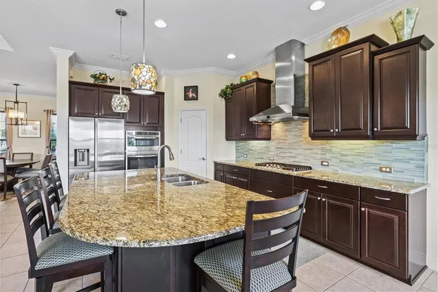 a kitchen with stainless steel appliances granite countertop a sink counter space cabinets and furniture