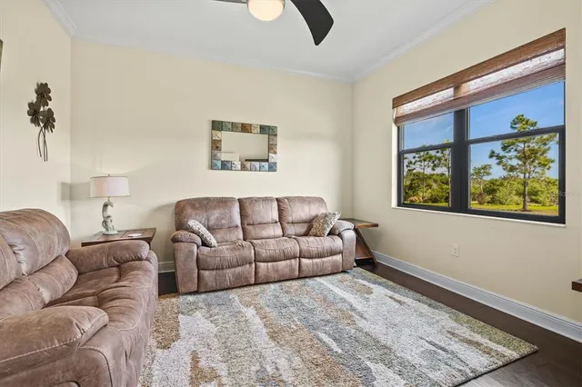 a living room with furniture and a rug