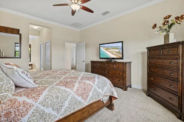 a bedroom with a bed and a dresser