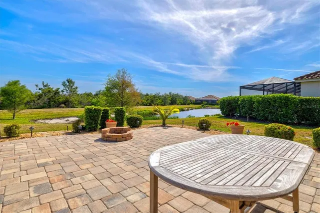 a view of swimming pool with sitting area