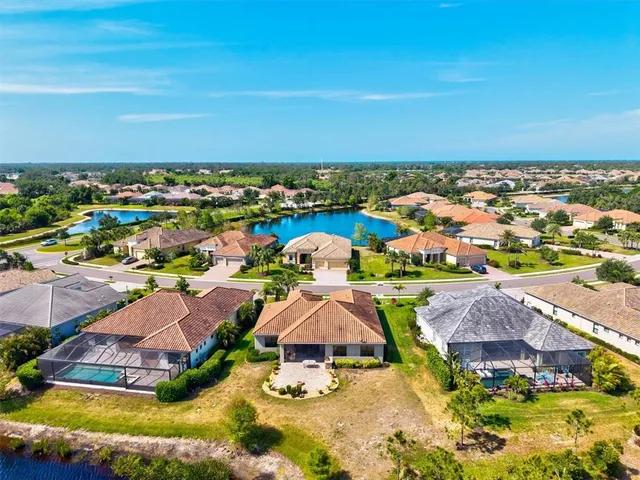 an aerial view of a house with a swimming pool yard and outdoor seating