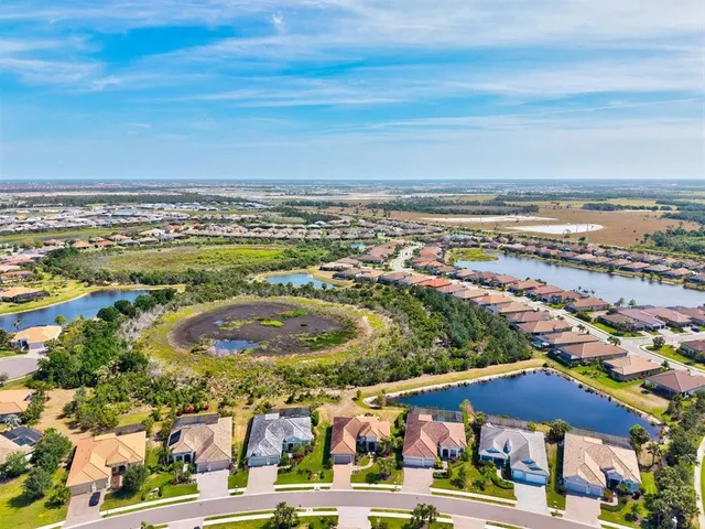 an aerial view of residential building with parking space