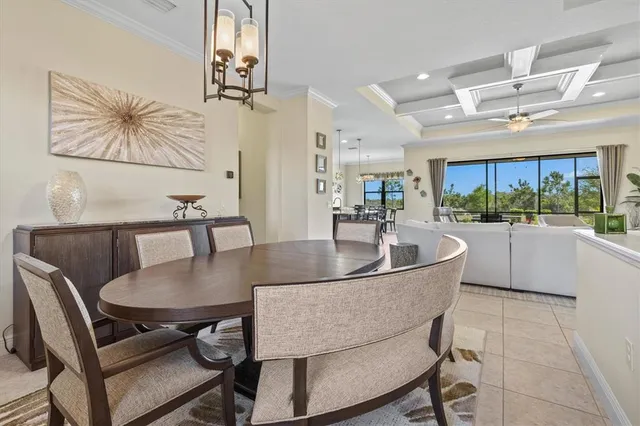 a kitchen with a dining table and chairs