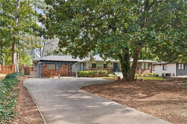 a stove top oven sitting inside of a kitchen