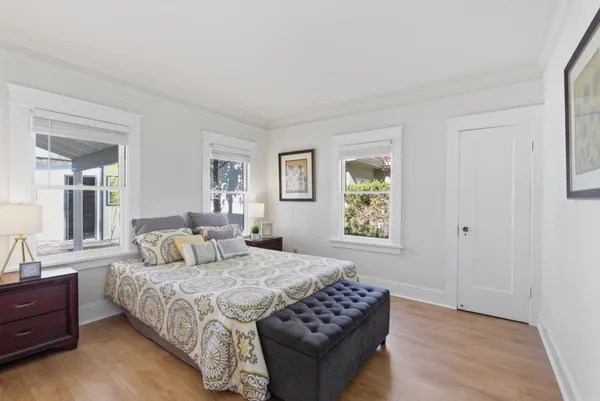 a bedroom with a bed and a dresser