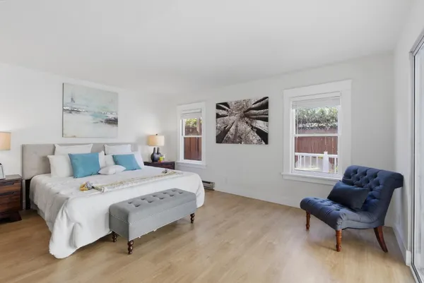 a bedroom with a bed and a couch