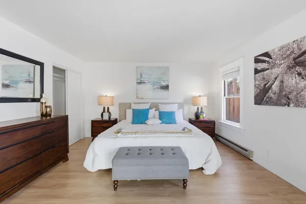 a bed room with a bed and window