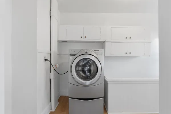a utility room with dryer and washer