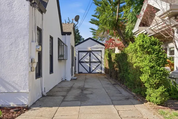 a view of a pathway both side of house