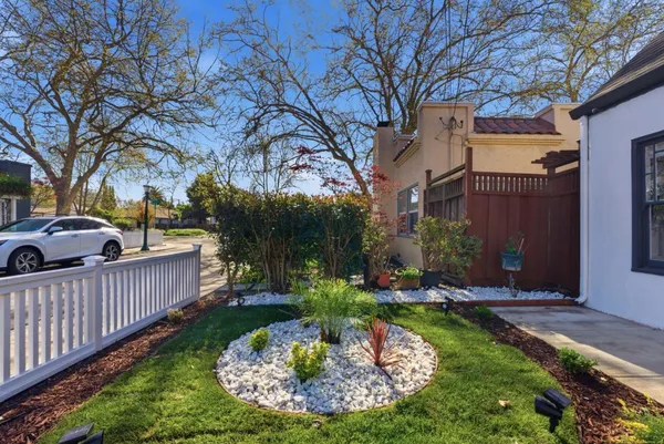 a view of a house with backyard fire pit and outdoor seating