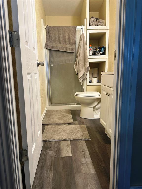 104 Mimosa Way Venus, TX 76084 - Photo 11 of 37 a bathroom with a toilet and a shower