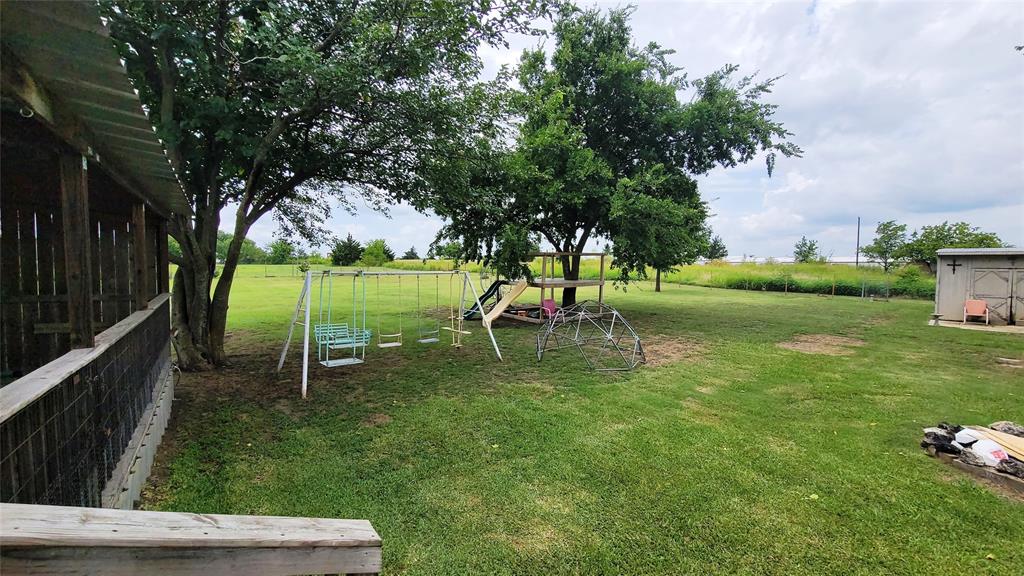 104 Mimosa Way Venus, TX 76084 - Photo 14 of 37 a view of backyard with green space