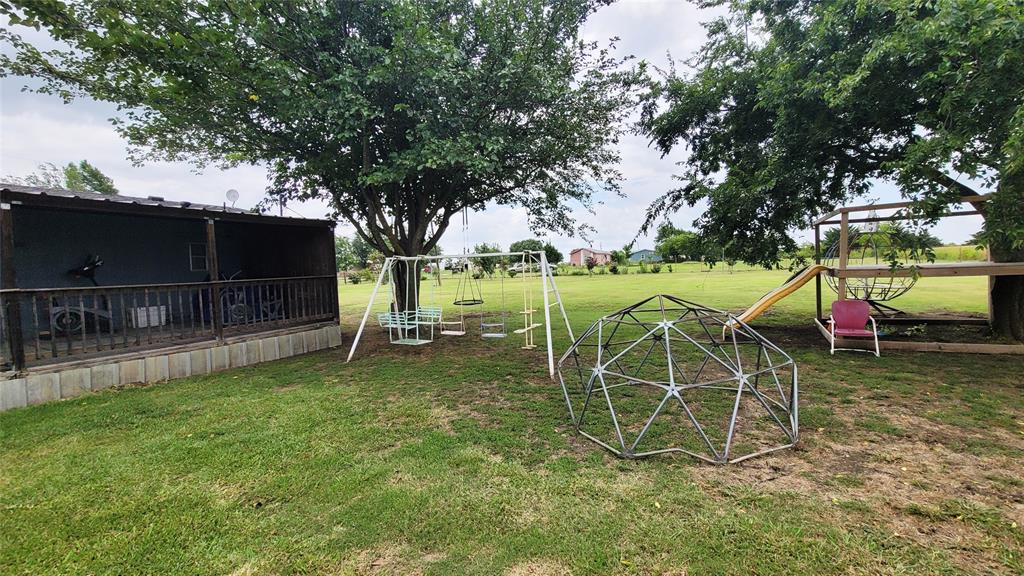 104 Mimosa Way Venus, TX 76084 - Photo 17 of 37 a view of a table and chairs in the patio