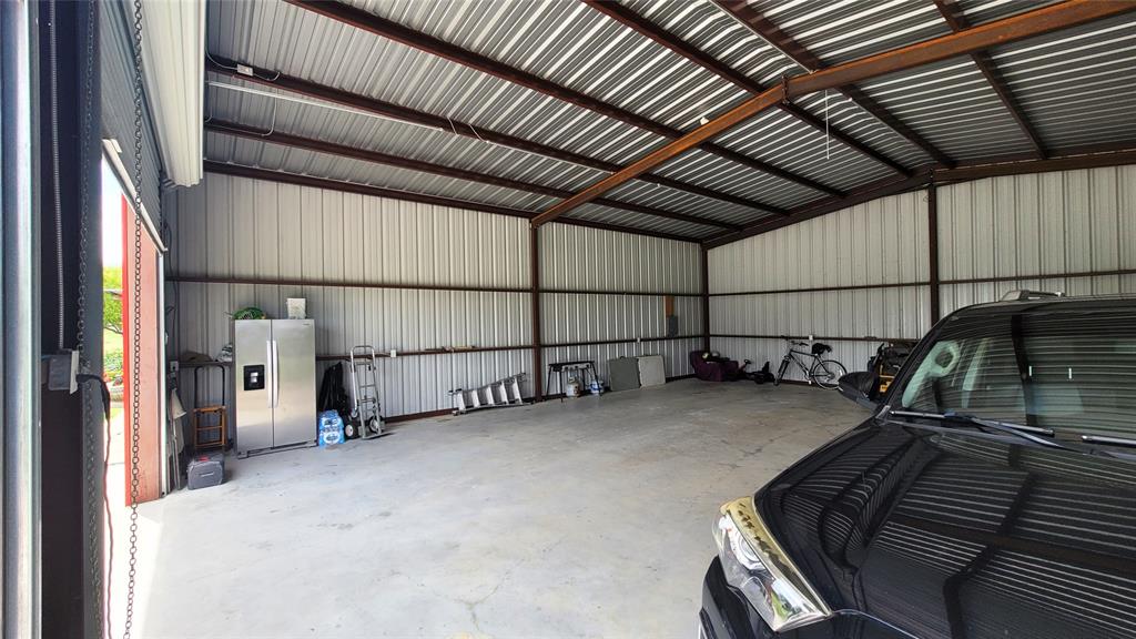 104 Mimosa Way Venus, TX 76084 - Photo 21 of 37 a view of a garage