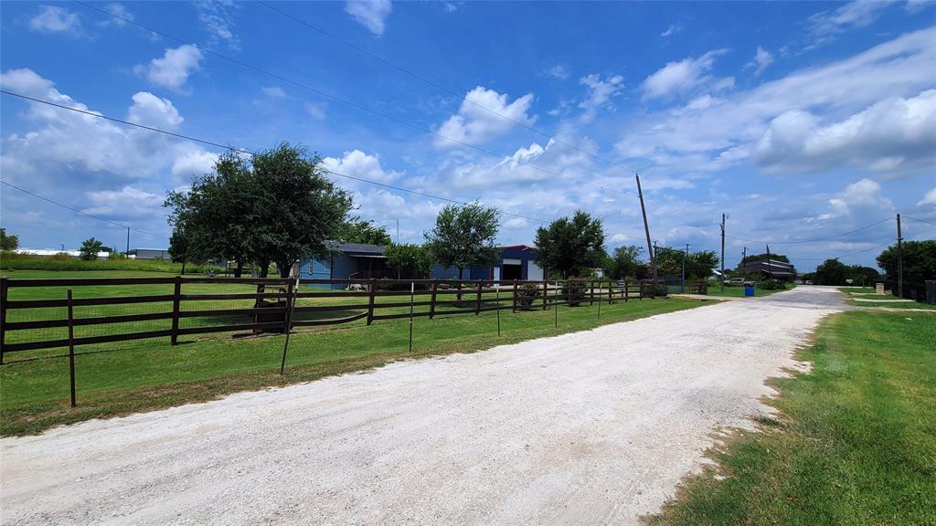 104 Mimosa Way Venus, TX 76084 - Photo 28 of 37 a view of street with tall trees