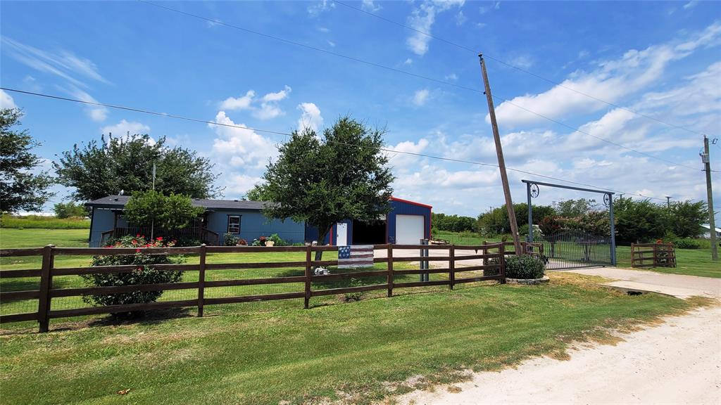 104 Mimosa Way Venus, TX 76084 - Photo 32 of 37 a view of a bench in front of house