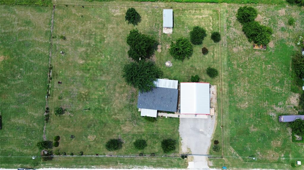 104 Mimosa Way Venus, TX 76084 - Photo 37 of 37 an aerial view of a house with a yard