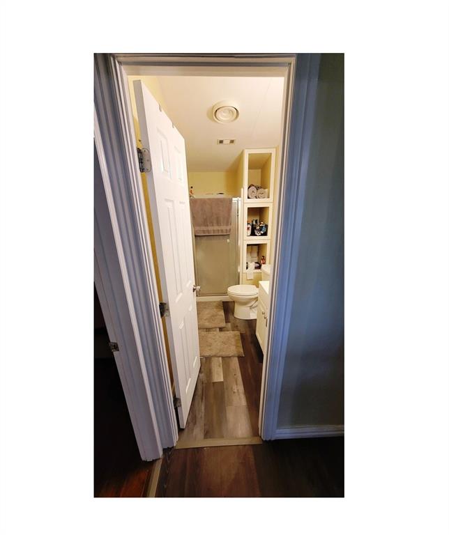 104 Mimosa Way Venus, TX 76084 - Photo 10 of 37 a view of living room with a fireplace and wooden floor