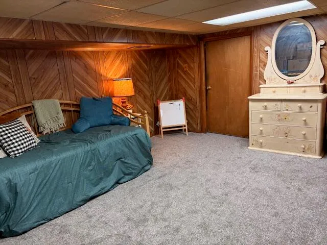 a view of a room with a sink and a mirror