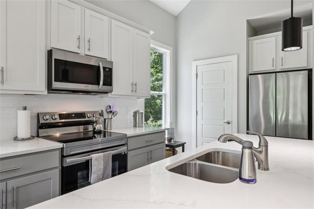 250 Stagecoach Road Oxford, GA 30054 - Photo 24 of 76 a kitchen with a sink and a microwave