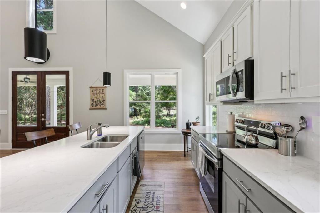 250 Stagecoach Road Oxford, GA 30054 - Photo 26 of 76 a kitchen with a stove a sink and a microwave