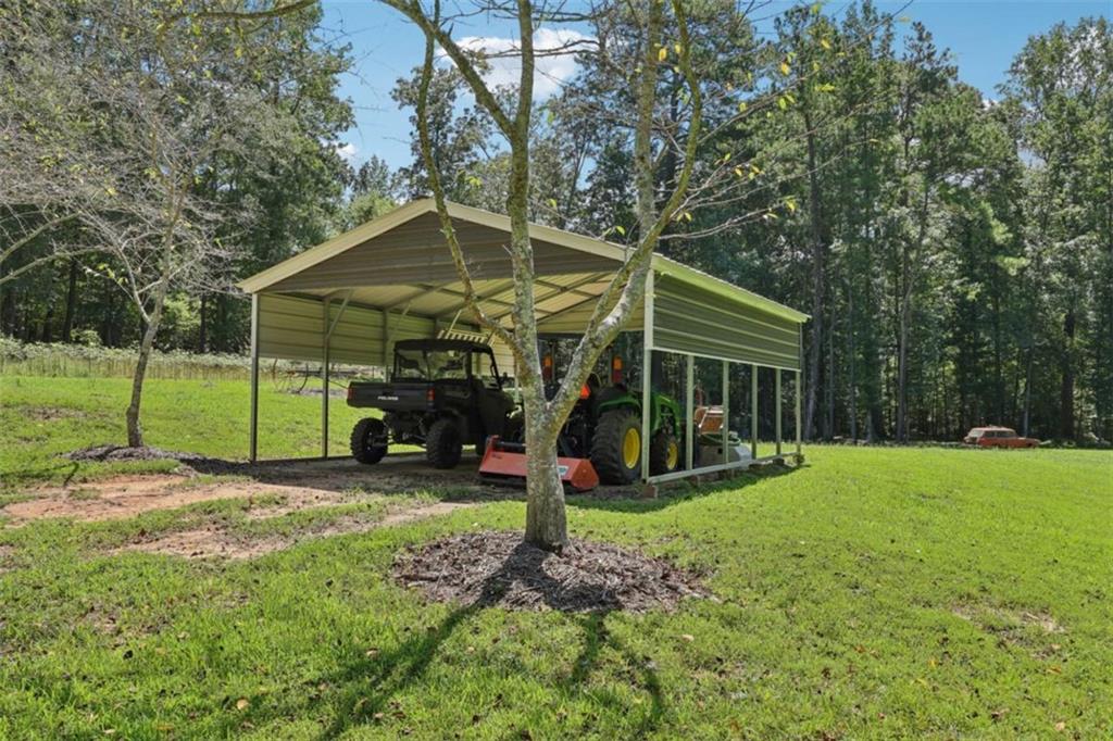 250 Stagecoach Road Oxford, GA 30054 - Photo 48 of 76 a view of a house with backyard and a tree