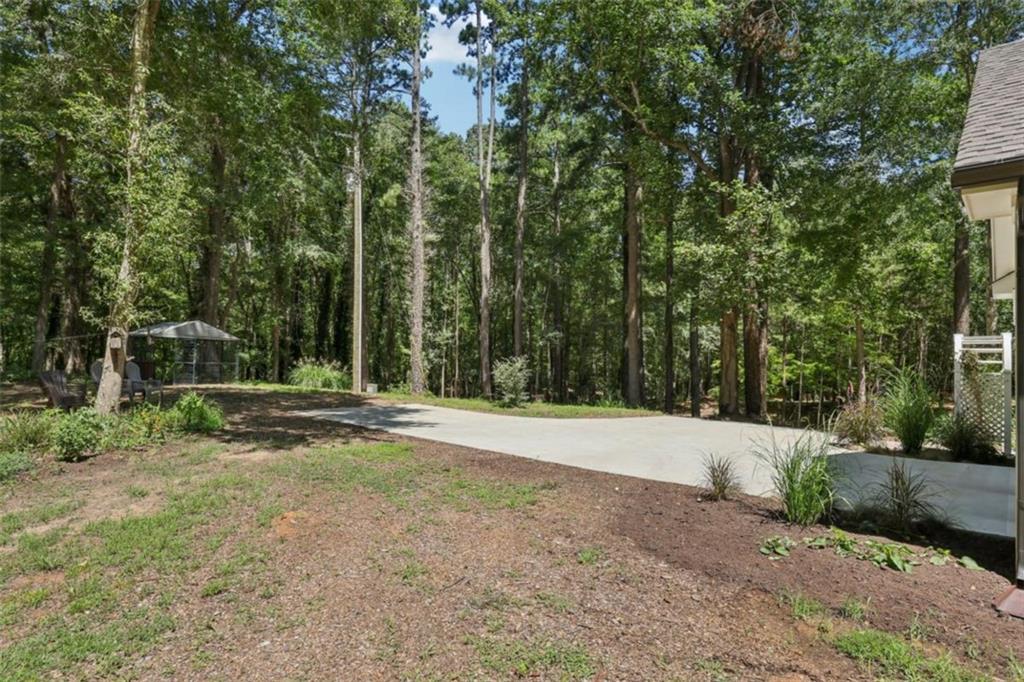 250 Stagecoach Road Oxford, GA 30054 - Photo 57 of 76 a view of a field with trees in the background