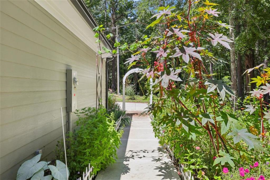 250 Stagecoach Road Oxford, GA 30054 - Photo 66 of 76 a pathway of a house with flower plants