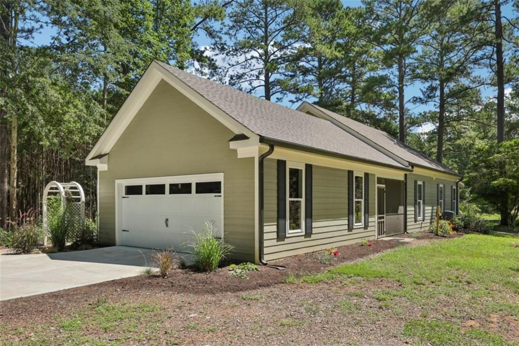 250 Stagecoach Road Oxford, GA 30054 - Photo 10 of 76 a view of a house with yard and plants