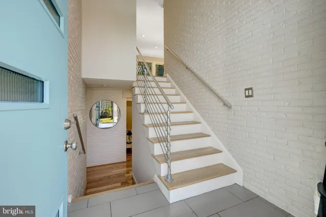 a front view of house with yard outdoor seating and green space