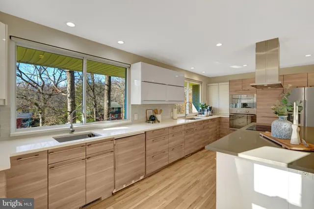 a building with pool table and chairs next to a yard