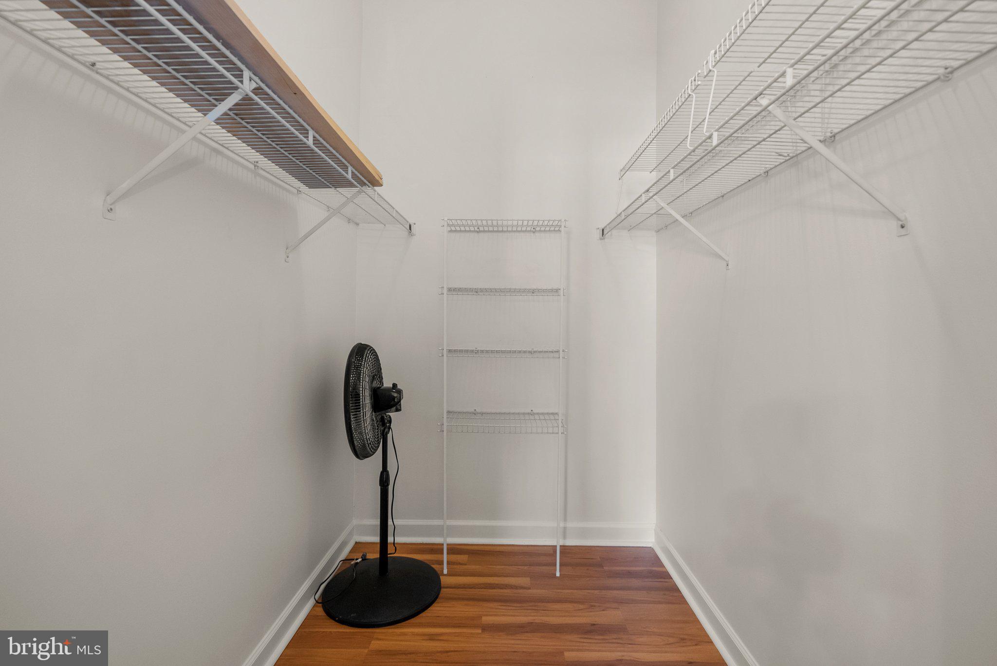 3301 Sir Thomas Drive, Unit 6B41 Silver Spring, MD 20904 - Photo 20 of 27 a table and a glass door with glass shower