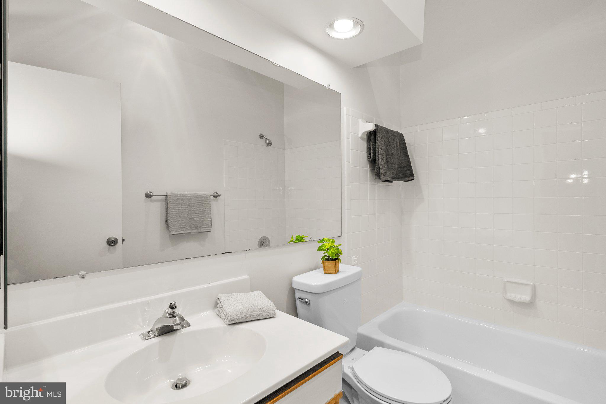 3301 Sir Thomas Drive, Unit 6B41 Silver Spring, MD 20904 - Photo 26 of 27 a bathroom with a sink and bathtub