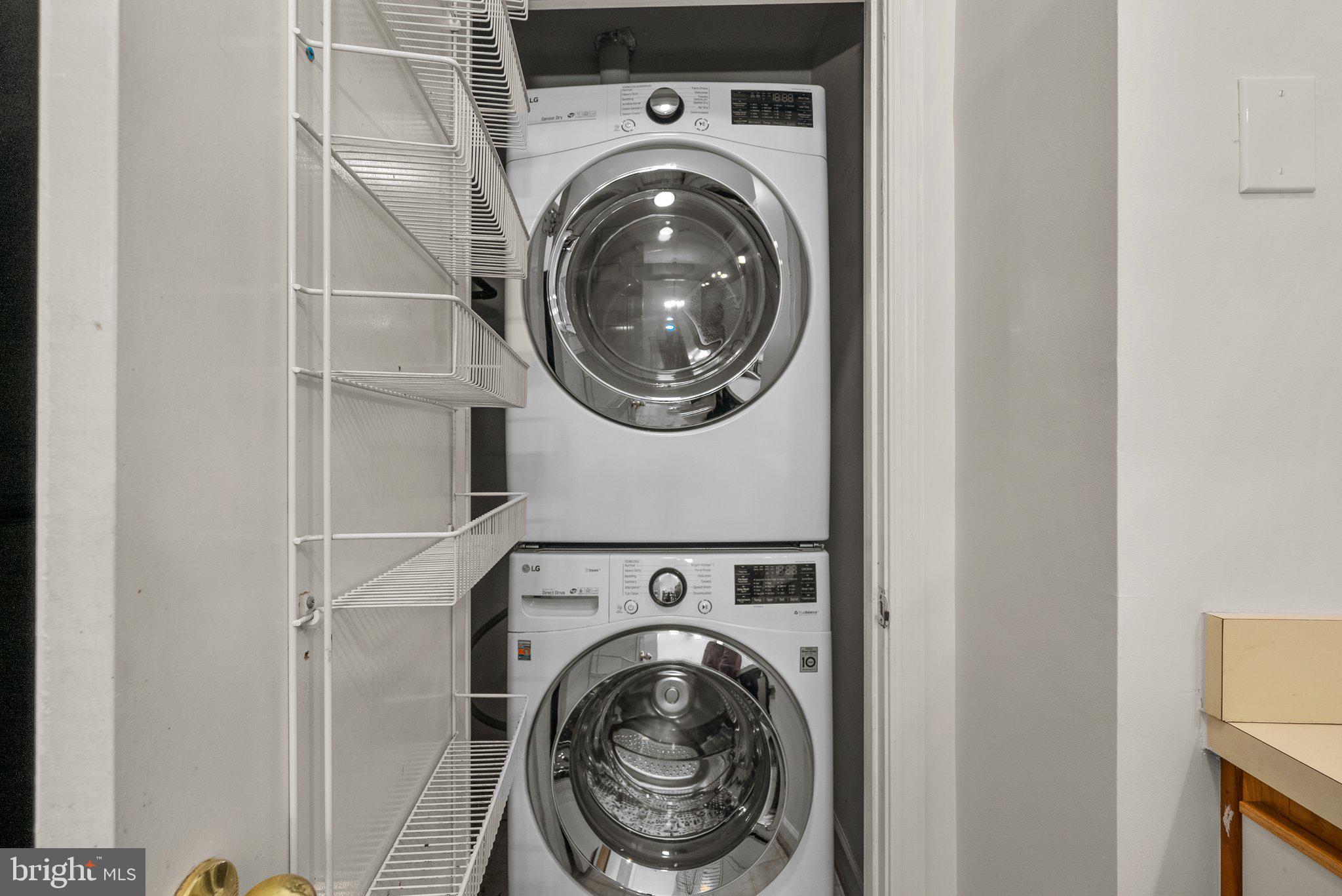 3301 Sir Thomas Drive, Unit 6B41 Silver Spring, MD 20904 - Photo 8 of 27 a utility room with dryer and washer
