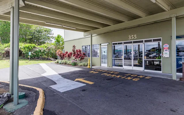 a view of a porch with furniture and next to a yard