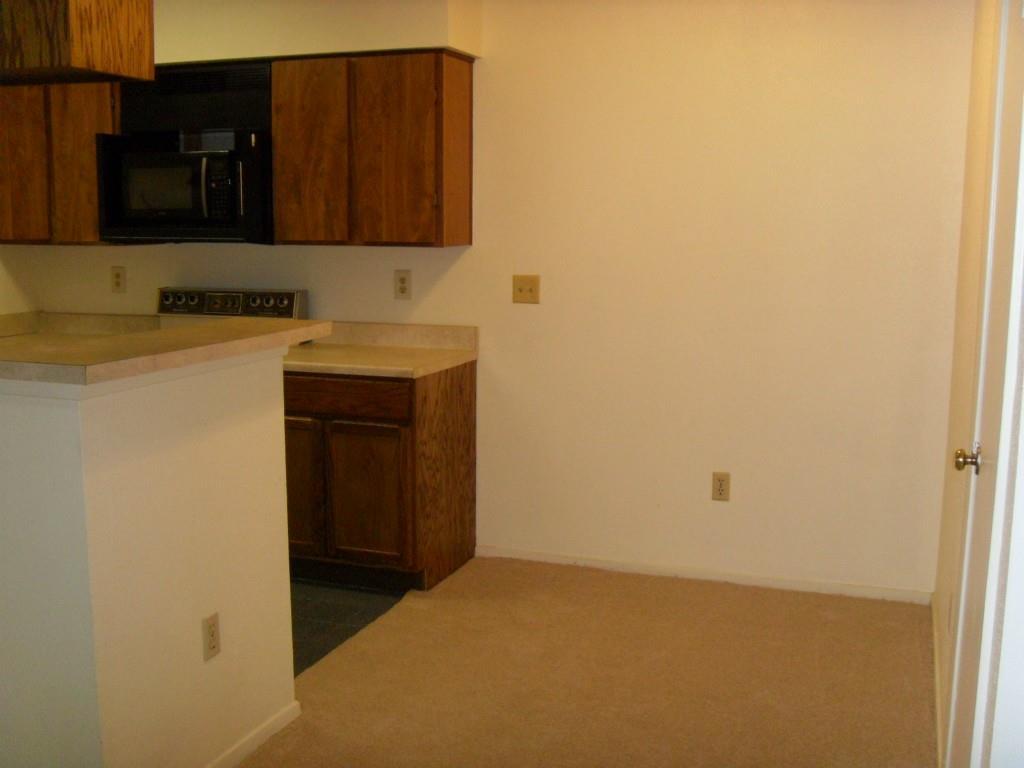 114 East 31st Street, Unit 206 Austin, TX 78705 - Photo 5 of 9 a bathroom with a sink and a mirror